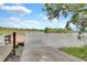 Scenic view of boat dock and ramp leading to tranquil lake waters surrounded by lush vegetation at 455 Lazio Cir, Debary, FL 32713