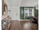 Entryway with hardwood floors, view to formal dining room, and natural light at 455 Lazio Cir, Debary, FL 32713