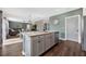 Kitchen island with granite countertops overlooks living and dining areas at 455 Lazio Cir, Debary, FL 32713