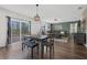 Open-concept living space with dining area and sliding glass doors at 455 Lazio Cir, Debary, FL 32713
