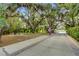 Inviting park area with picnic tables surrounded by lush greenery and charming brick pathways at 455 Lazio Cir, Debary, FL 32713