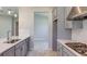 Well-designed kitchen features quartz countertops, stainless steel appliances, and wood look floors at 4704 Coral Harbour Rd, Kissimmee, FL 34758