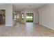 Bright living room features tile flooring, recessed lighting, and sliding glass doors to the backyard at 4704 Coral Harbour Rd, Kissimmee, FL 34758
