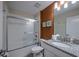 Bathroom featuring shower/tub with glass door and granite topped vanity at 4807 Kings Castle Cir, Kissimmee, FL 34746