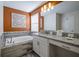 Contemporary bathroom with soaking tub and a granite topped vanity at 4807 Kings Castle Cir, Kissimmee, FL 34746
