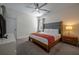 Comfortable bedroom with a large bed, stylish nightstands, and modern lighting at 4807 Kings Castle Cir, Kissimmee, FL 34746
