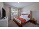 Comfortable bedroom with white and orange decor at 4807 Kings Castle Cir, Kissimmee, FL 34746