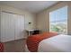 Well-lit bedroom features a desk and closet near a brightly lit window at 4807 Kings Castle Cir, Kissimmee, FL 34746