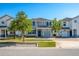 Charming two-story home boasts manicured lawn, attached garage, and welcoming entrance at 4807 Kings Castle Cir, Kissimmee, FL 34746