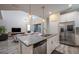 Bright open kitchen featuring stainless steel appliances, granite countertops, and a skylight at 4807 Kings Castle Cir, Kissimmee, FL 34746