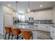 Stylish kitchen with a breakfast bar island, stainless steel appliances, and a neutral color scheme at 4807 Kings Castle Cir, Kissimmee, FL 34746