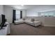 Upstairs loft area featuring a comfortable sofa and a wall-mounted television at 4807 Kings Castle Cir, Kissimmee, FL 34746