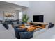 Bright living room area featuring modern furnishings, decor, and a large television at 4807 Kings Castle Cir, Kissimmee, FL 34746