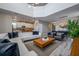 Open-concept living space with modern furnishings, kitchen, and a high ceiling at 4807 Kings Castle Cir, Kissimmee, FL 34746