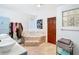 Bright bathroom featuring a soaking tub, double vanity, and decorative tile accents at 511 E Mirror Lake Dr, Fruitland Park, FL 34731