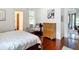 Bedroom with hardwood floors, natural light, and neutral decor at 511 E Mirror Lake Dr, Fruitland Park, FL 34731
