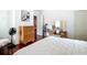 Spacious bedroom featuring natural light, hardwood floors, and ample storage space with dressers at 511 E Mirror Lake Dr, Fruitland Park, FL 34731