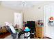 Inviting bedroom with ample space, neutral walls, and comfortable seating, perfect for relaxing or entertaining at 511 E Mirror Lake Dr, Fruitland Park, FL 34731