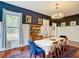 Dining room features bold wall colors, classic decor, and elegant details at 511 E Mirror Lake Dr, Fruitland Park, FL 34731