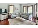 Bright, spacious living room with large windows and ample seating at 511 E Mirror Lake Dr, Fruitland Park, FL 34731
