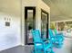 Inviting front porch featuring charming rocking chairs, creating a welcoming and relaxing outdoor space for residents at 511 E Mirror Lake Dr, Fruitland Park, FL 34731
