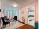 Bright sitting room with eclectic decor, a textured ceiling, and views to the outside at 511 E Mirror Lake Dr, Fruitland Park, FL 34731