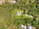 Expansive estate featuring privacy and serene views of the surrounding landscape and acreage at 5180 Garlanger Trl, Oviedo, FL 32765