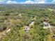 Home nestled in a canopy of trees, featuring ample acreage and stunning natural landscape at 5180 Garlanger Trl, Oviedo, FL 32765
