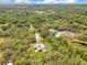 Lush landscape with scenic views surrounds a home with a large screened-in pool area at 5180 Garlanger Trl, Oviedo, FL 32765