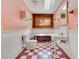 Bathroom with checkerboard floor, vintage sink, tub, and quirky decor at 5180 Garlanger Trl, Oviedo, FL 32765