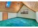 Bright upstairs bedroom with skylight, wood paneled ceiling and green carpet at 5180 Garlanger Trl, Oviedo, FL 32765