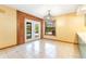 Dining room with tiled floor, new light fixture, and natural light at 5180 Garlanger Trl, Oviedo, FL 32765