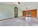 Spacious living room featuring lots of natural light and double doors to the outside at 5180 Garlanger Trl, Oviedo, FL 32765