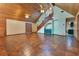 Spacious living room featuring wooden ceilings, tile floors, wooden staircase, and a built-in bar at 5180 Garlanger Trl, Oviedo, FL 32765