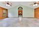Living room with natural light, cathedral ceilings, and wood accent wall at 5180 Garlanger Trl, Oviedo, FL 32765
