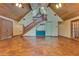 Expansive living room featuring tile flooring, wooden staircase with a bar, and wood-paneled ceilings at 5180 Garlanger Trl, Oviedo, FL 32765