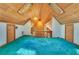 Cozy loft area with skylights, wood-paneled ceiling, and blue carpet at 5180 Garlanger Trl, Oviedo, FL 32765