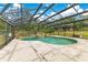 Screened in pool area with rock waterfall at 5180 Garlanger Trl, Oviedo, FL 32765