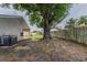 Expansive backyard featuring a mature tree, providing shade and privacy for outdoor enjoyment at 5423 Blueberry Dr, Orlando, FL 32811