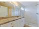 Updated bathroom featuring a vanity with granite countertop and tiled walk-in shower at 5423 Blueberry Dr, Orlando, FL 32811