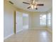 Cozy bedroom with tile floors and plenty of natural light at 5423 Blueberry Dr, Orlando, FL 32811