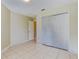 Bedroom features tile flooring and a large closet for storage at 5423 Blueberry Dr, Orlando, FL 32811