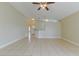 Open-concept living area featuring neutral tones, tile floors, and recessed lighting at 5423 Blueberry Dr, Orlando, FL 32811