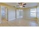 Comfortable main bedroom with tile floors and access to an ensuite bathroom at 5423 Blueberry Dr, Orlando, FL 32811