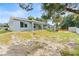 Backyard featuring a spacious yard, patio, and lush greenery, perfect for outdoor living at 5438 Brownell St, Orlando, FL 32810