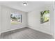 Bedroom featuring modern floors and window with views of exterior at 5438 Brownell St, Orlando, FL 32810