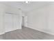 Bedroom featuring modern floors and closet with views of exterior at 5438 Brownell St, Orlando, FL 32810