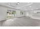 Bright living room with hardwood floors and sliding glass doors at 5438 Brownell St, Orlando, FL 32810