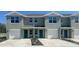 Modern townhouse featuring a one car garage and welcoming facade at 548 Zinfandel Dr, Daytona Beach, FL 32117