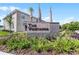 A large community sign at the entrance with flower beds and palm trees at 550 Zinfandel Dr, Daytona Beach, FL 32117